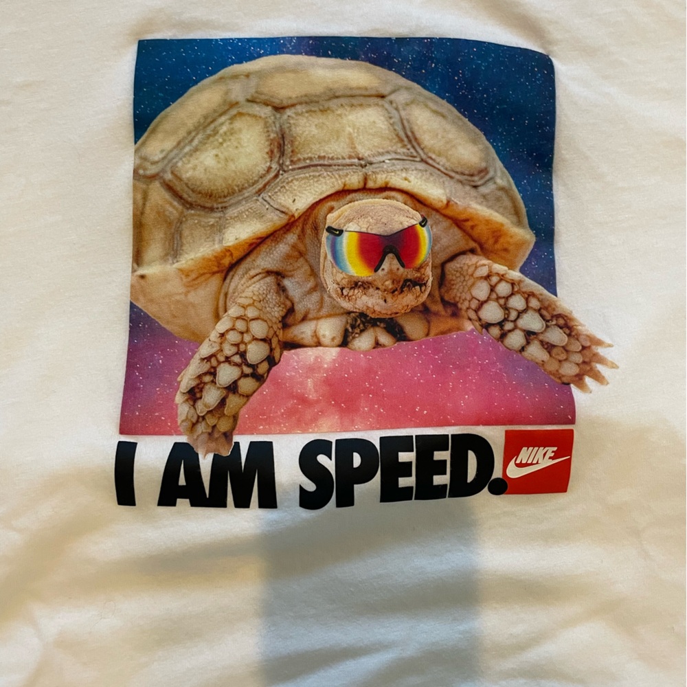 Nike White Tee with Turtle and 'I Am Speed' Graphic